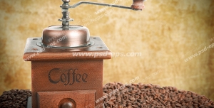 عکس با کیفیت آسیاب دستی مورد استفاده برای آسیاب کردن قهوه در کنار دانه های قهوه